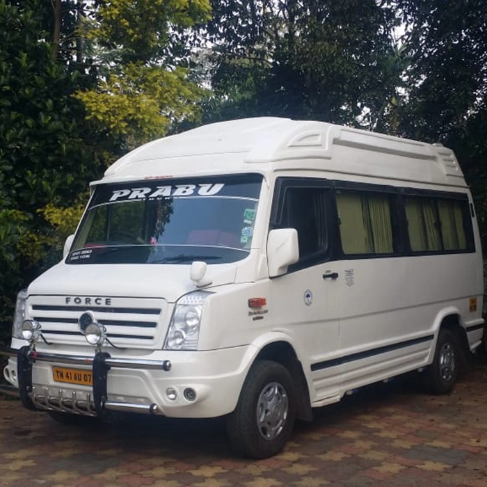 12 seater Force Traveller parked and ready for rental in Coimbatore